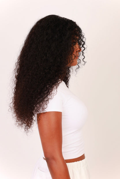 Side view of model to show thick and full deep curly bundles 